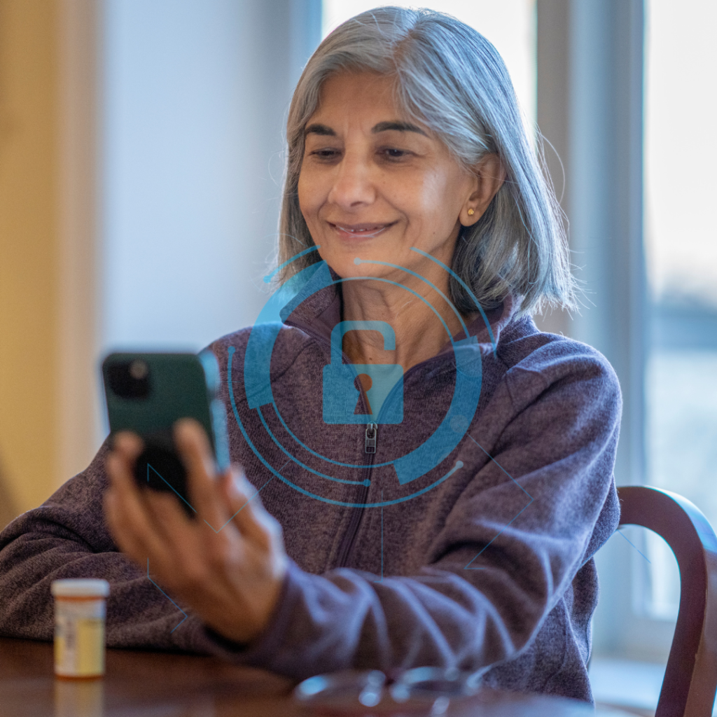 A digital shield (a classic symbol of cybersecurity) projected onto a health environment, such as an elderly person using a mobile phone