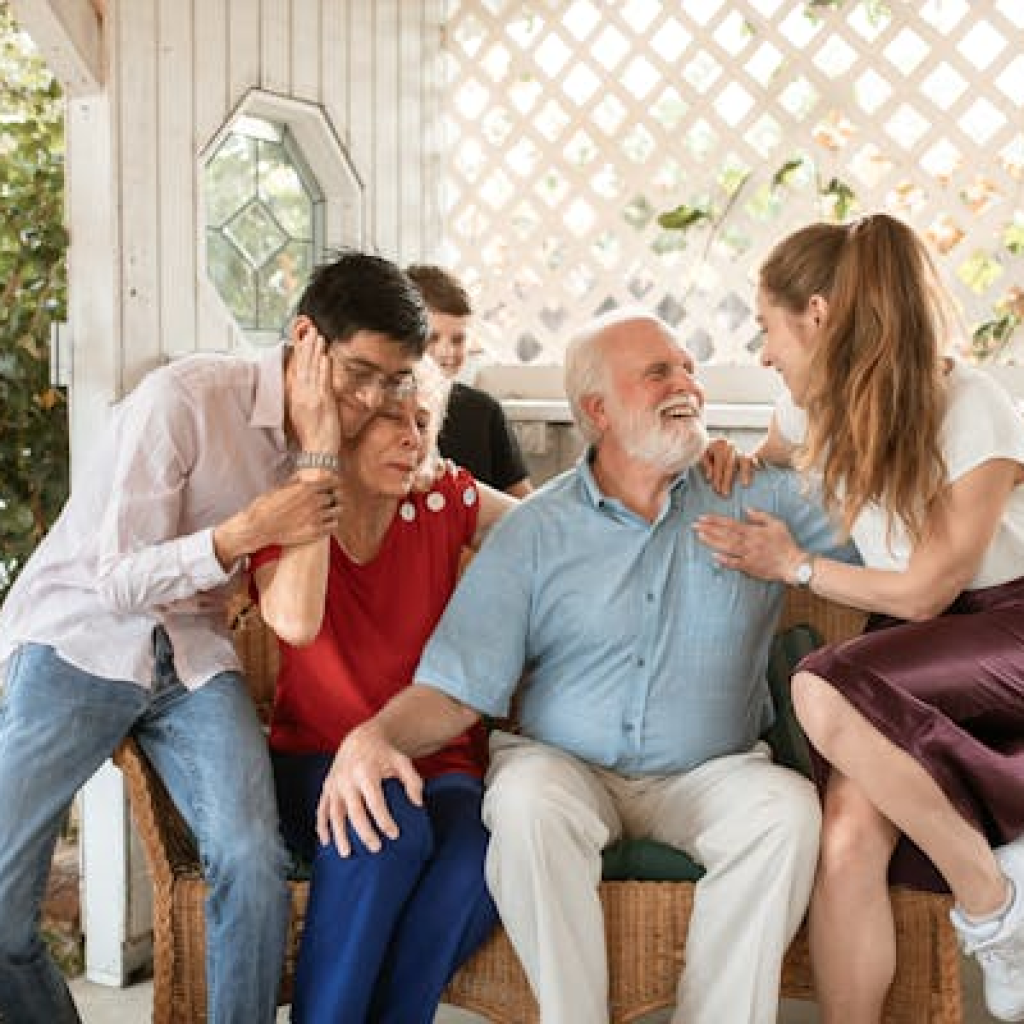 picture of grandparents laughing with apparently 2 of their grandchildren. the picture is an example of one of the key risk factors